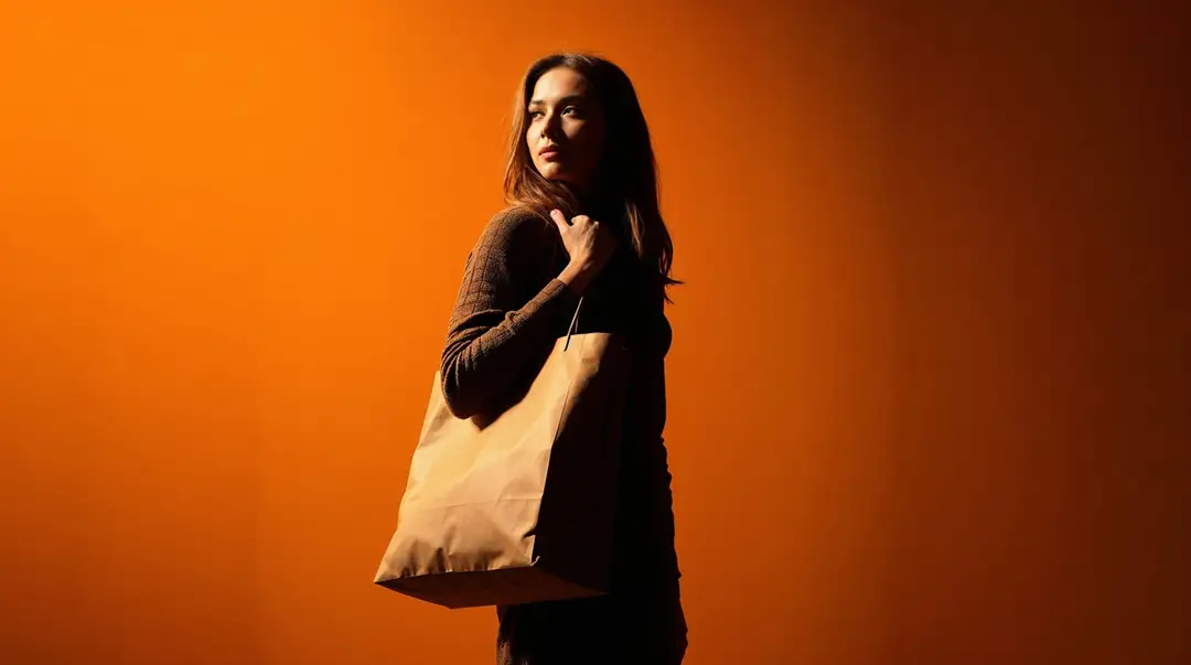 fashionable-woman-with-shopping-paper-bag