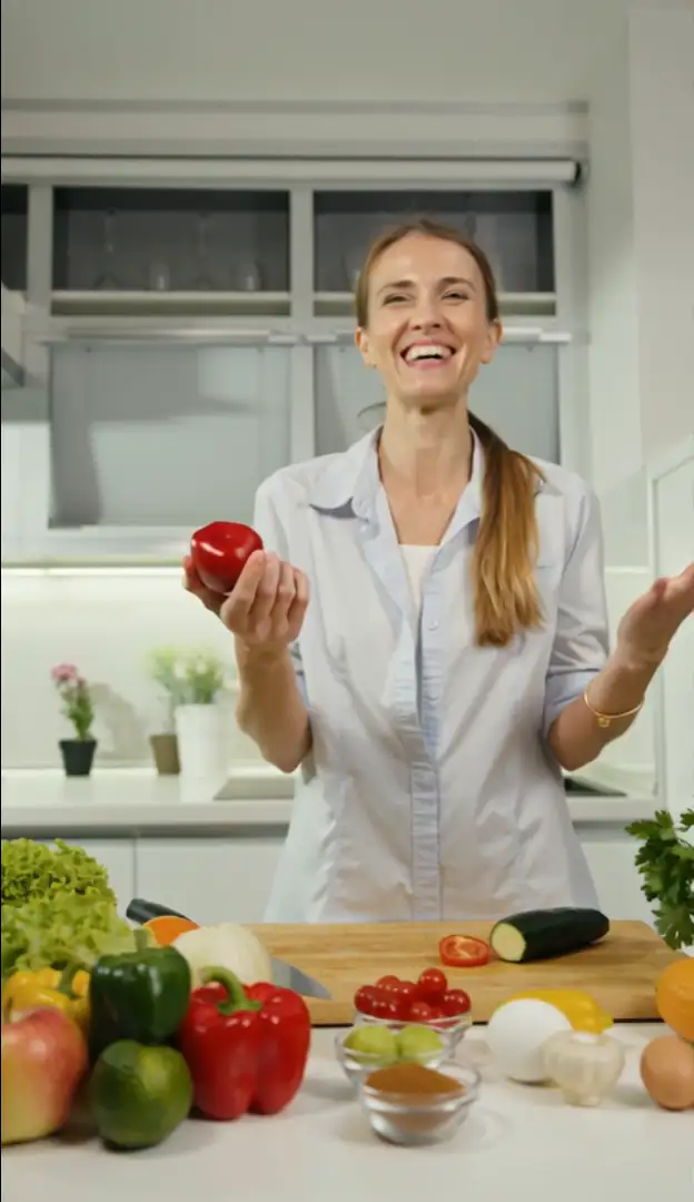 woman-in-kitchen-with-fresh-vegetables