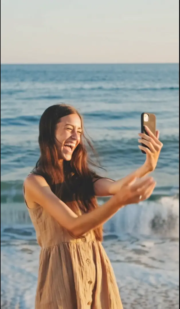 young-woman-taking-a-beach-selfie
