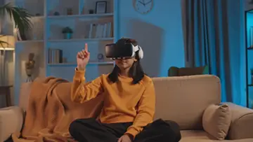 a-young-girl-uses-a-vr-headset-at-home