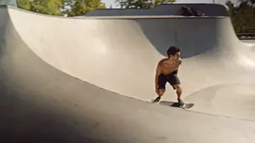 skateboarder-in-a-concrete-skatepark-bowl
