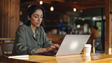 woman-working-in-a-warm-cafe