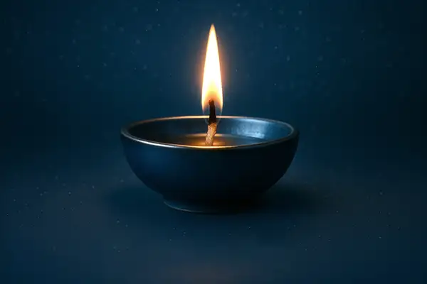 glowing-diwali-diya-on-dark-blue-background