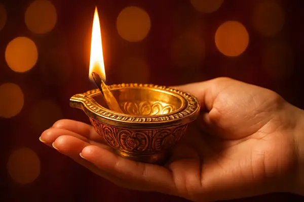 golden-diya-glowing-in-hand