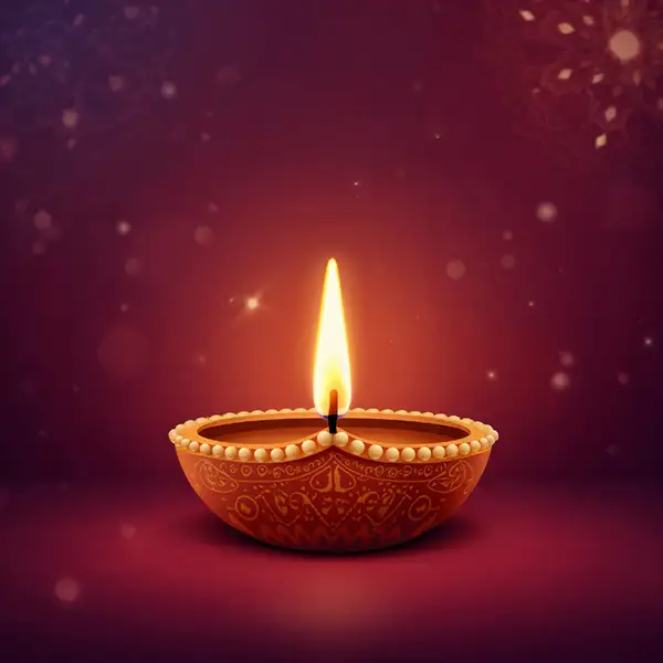 glowing-diwali-diya-on-maroon-background