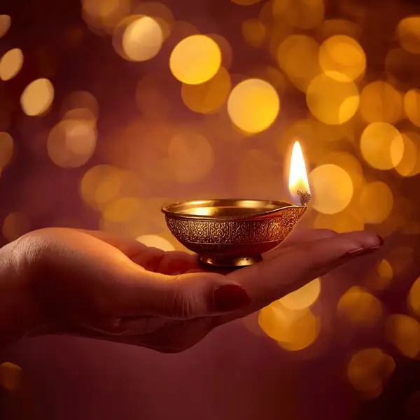 hand-with-a-glowing-diya